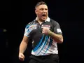 Gerwyn Price świętuje zwycięstwo na mistrzostwach świata w darta.