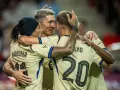 Piłkarze FC Barcelona, Raphinha, Lewandowski i Ferran Torres, świętują bramkę w meczu przeciwko Celcie Vigo.